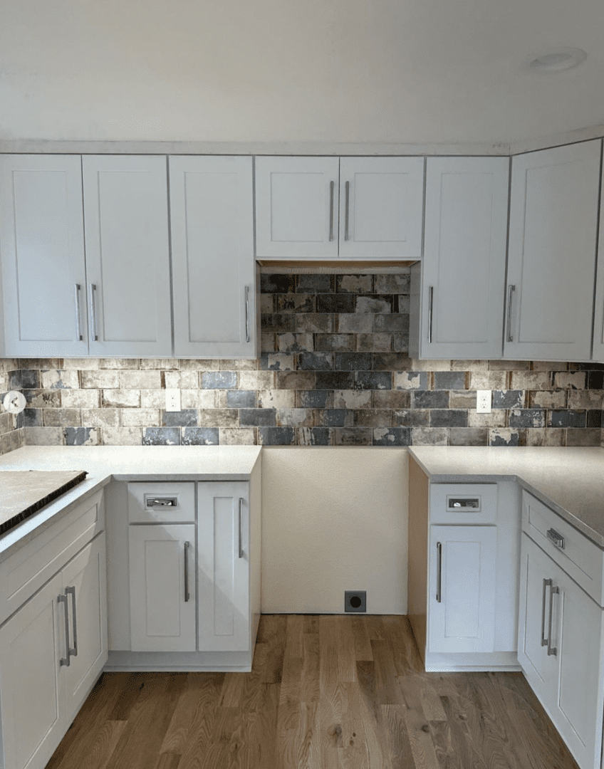 New kitchen remodel. Backsplash new, countertops under cabinet lighting, sink and flooring